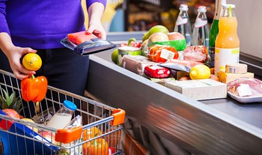 woman putting goods on counter